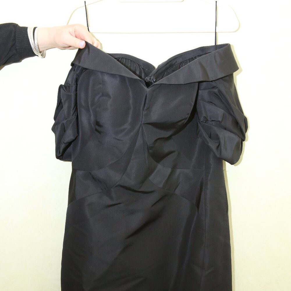 Black Silk strapless dress with built in corset, layered ruffle sleeve and slit